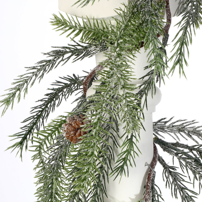 9 ft Artificial Spruce Christmas Garland draped across a fireplace mantel