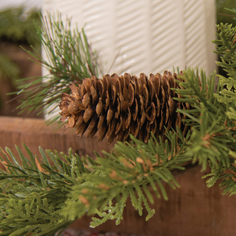 4 ft Magnolia Christmas Garland styled along a festive mantel
