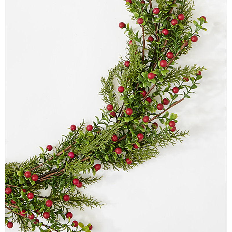 Set of 4 Real Touch Artificial Norfolk Pine Christmas Wreath hanging on a kitchen cabinet