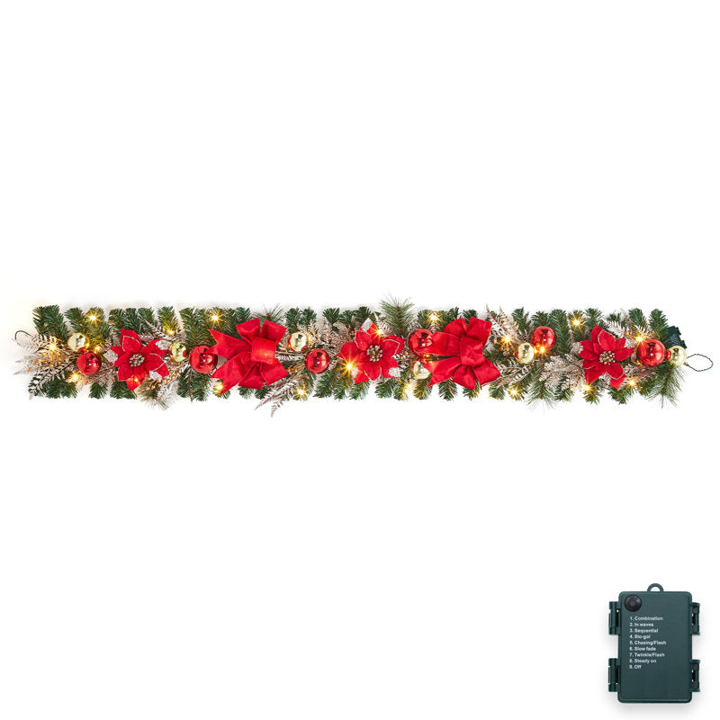 9 ft Pre-Lit Artificial Pine Christmas Garland draped across a fireplace mantel