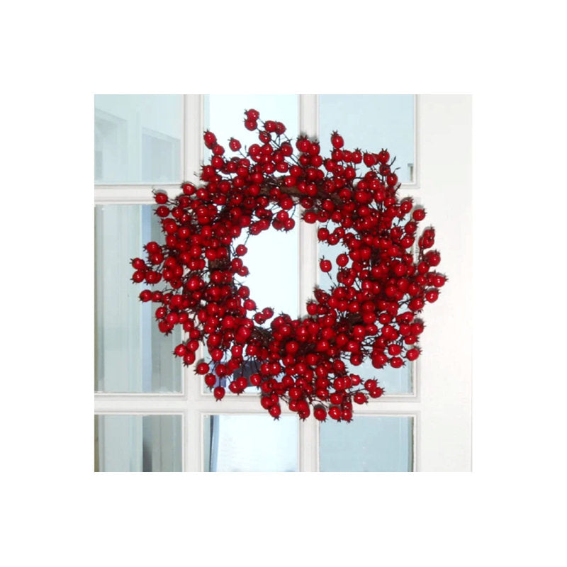 Frosted Christmas wreaths with berries