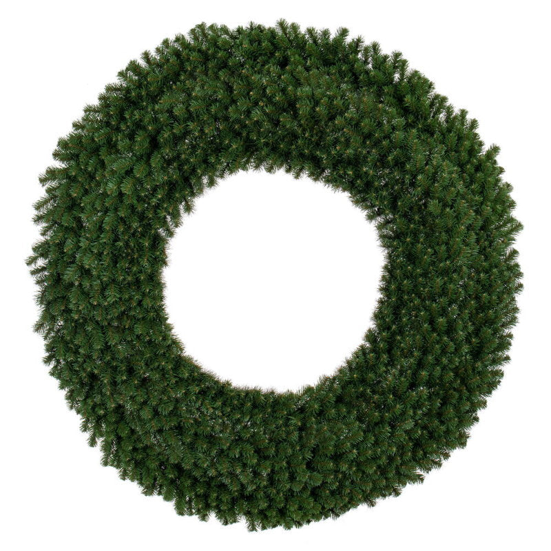 24" Artificial Pine Christmas Wreath hung on a wooden door