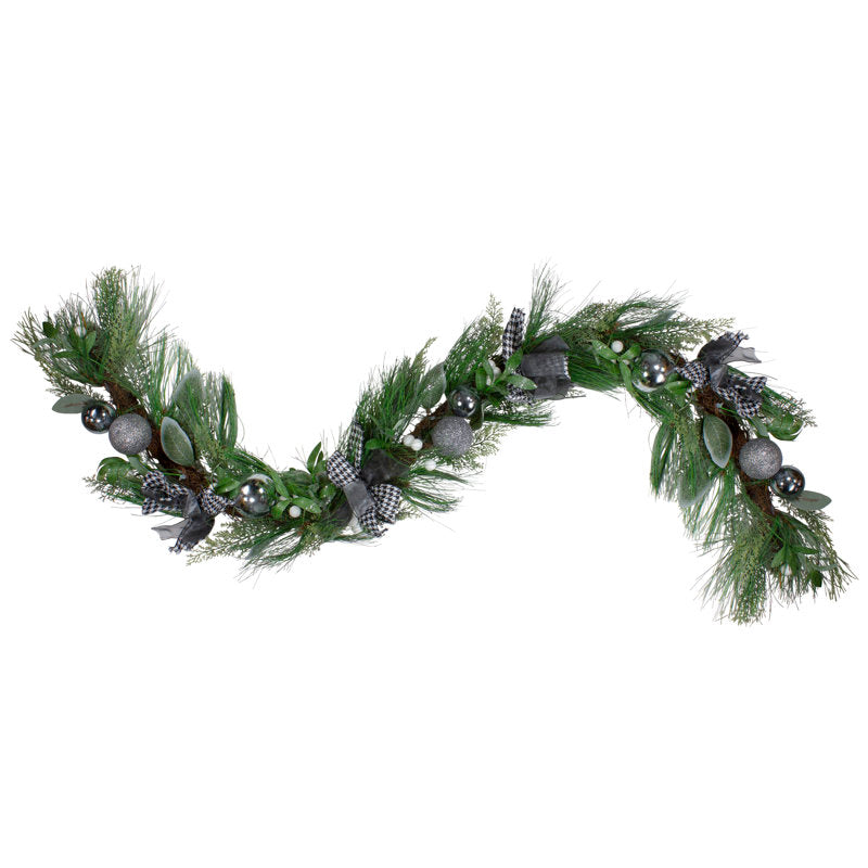 6 ft Pre-Lit Fir Christmas Garland wrapped around a staircase banister