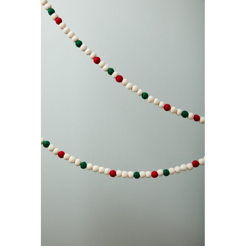 5.9 ft Artificial Berry Christmas Garland styled along a festive mantel