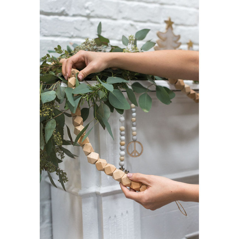 6 ft Pre-Lit Artificial Pine Christmas Garland framing a front doorway