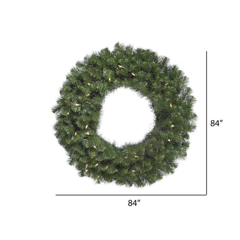 Pre-Lit Artificial Pine Christmas Wreath displayed on a front door