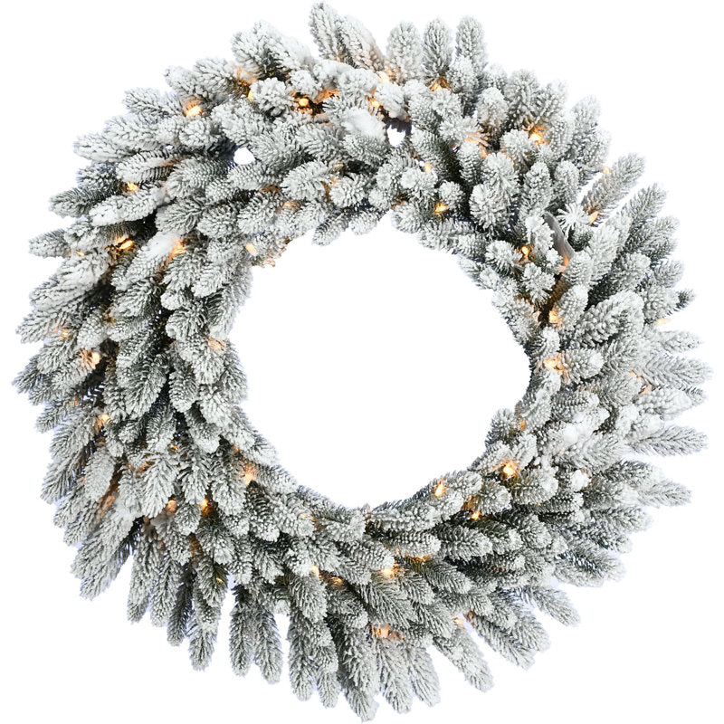Pre-Lit Flocked Artificial Pine Christmas Wreath hanging on a front door