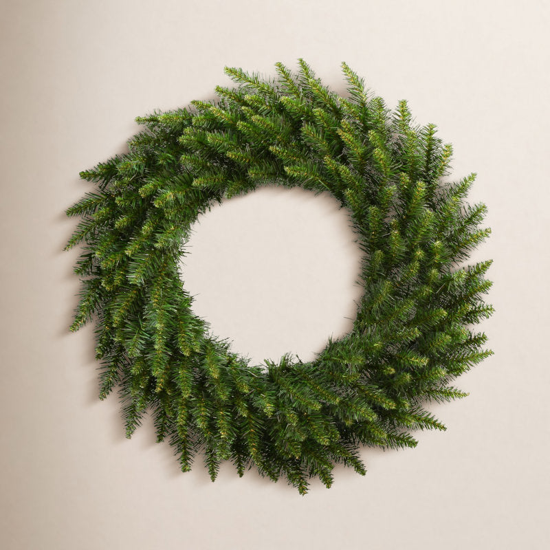 Frosted Artificial Pine Christmas Wreath displayed on a front door