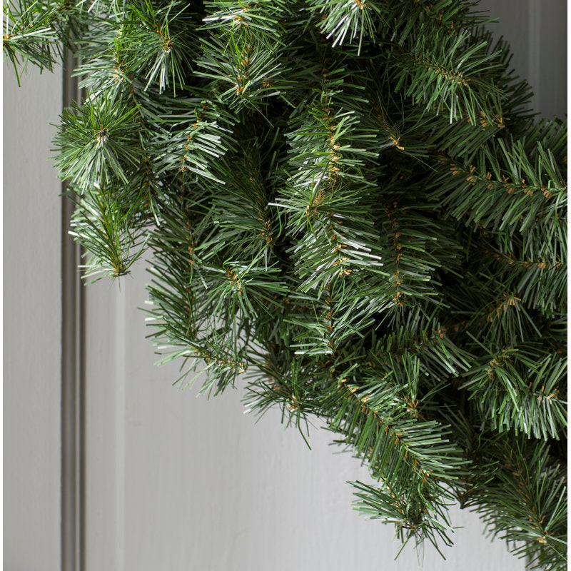 Artificial Christmas Wreath hanging on a front door