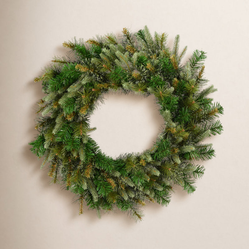 12" Artificial Pine Christmas Wreath displayed on a front door