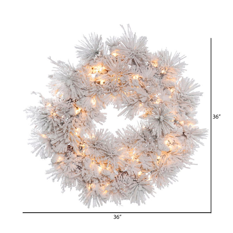 24" Pre-Lit Artificial Pine Christmas Wreath hung on a wooden door