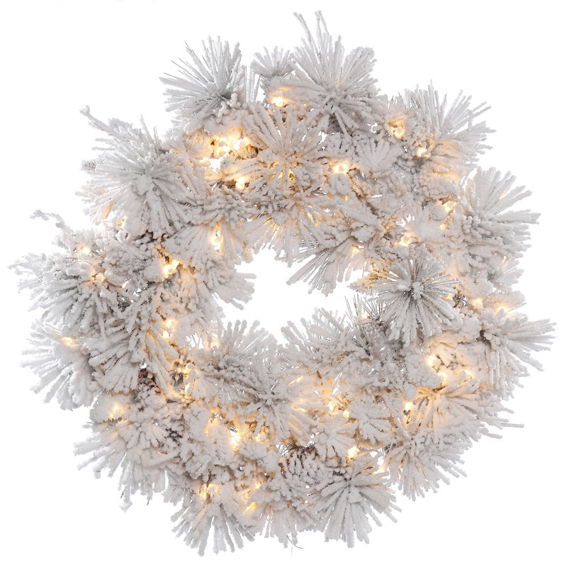 Flocked Artificial Christmas Wreath displayed on a front door