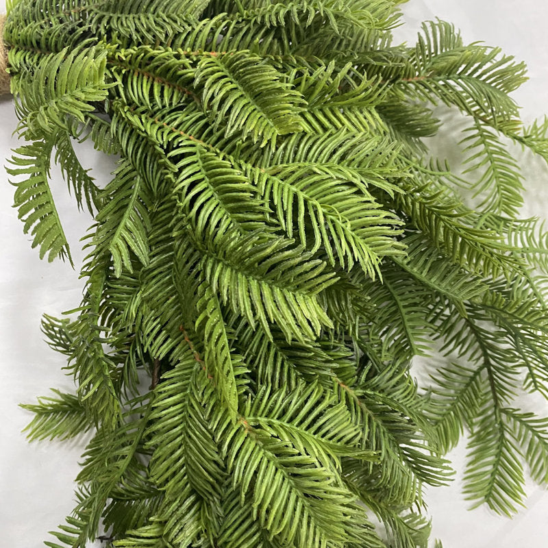 20" Artificial Pine Christmas Wreath hanging on a front door