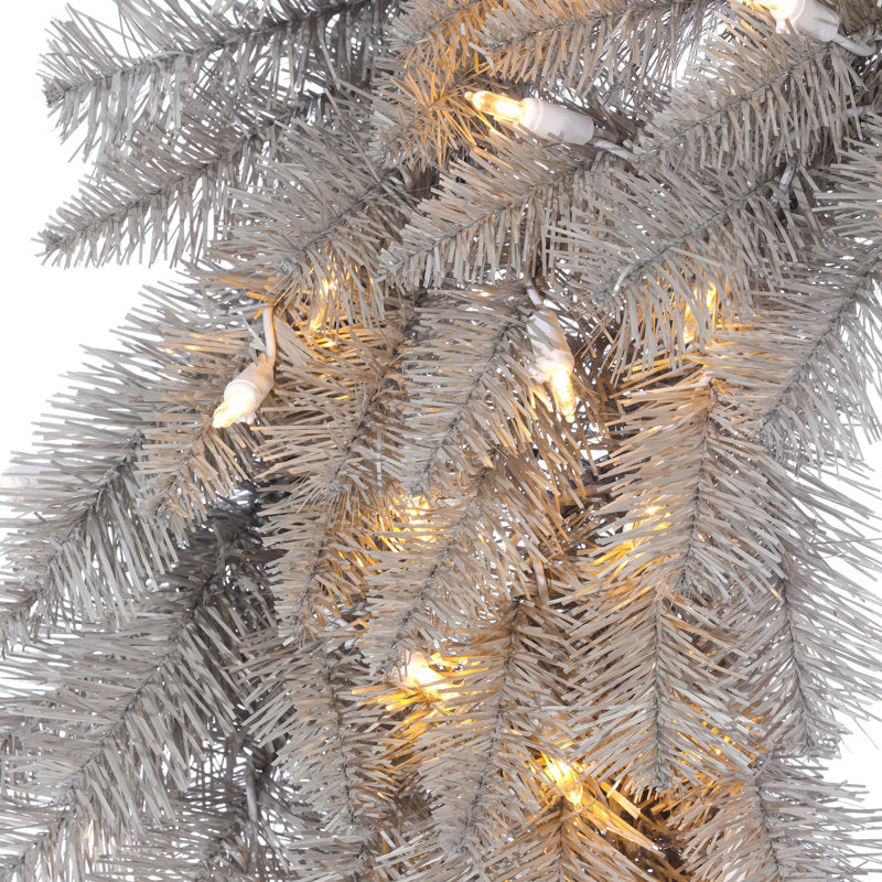 24" Pre-Lit Artificial Pine Christmas Wreath displayed on a front door