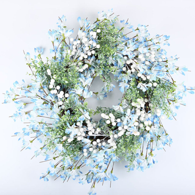 24" Artificial Berry Christmas Wreath hung on a wooden door