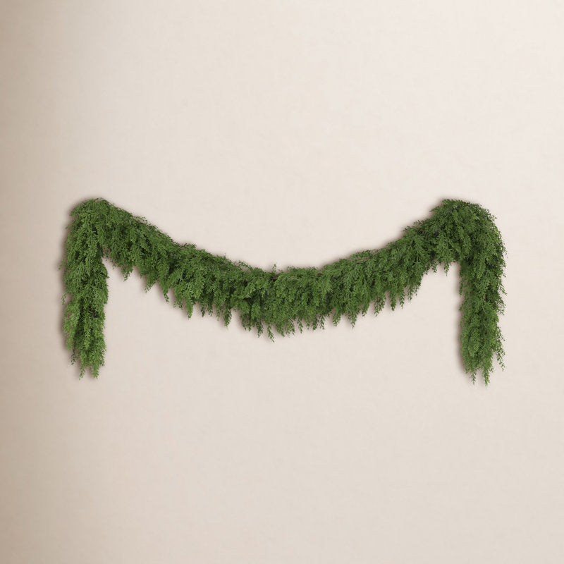6 ft Pink Pre-Lit Poinsettia Christmas Garland framing a front doorway