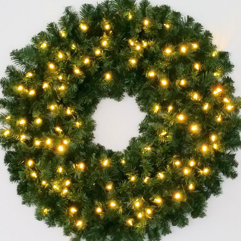 Pre-Lit Christmas Wreath displayed on a front door