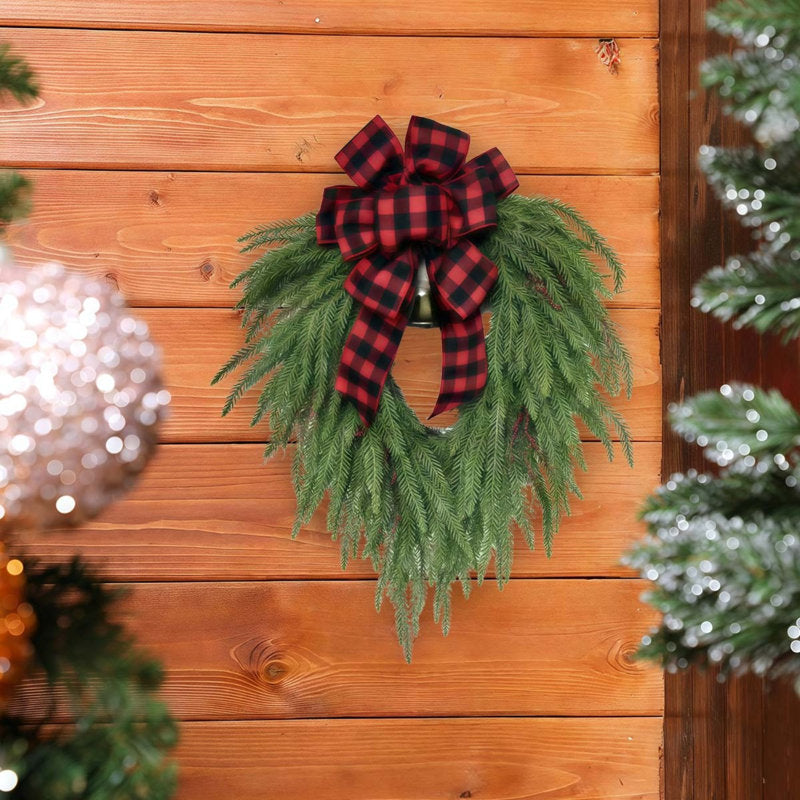 Flocked Artificial Pine Christmas Wreath hung on a wooden door