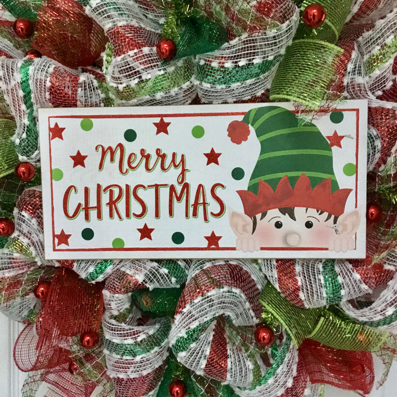 20" Pre-Lit Artificial Pine Christmas Wreath hung on a wooden door