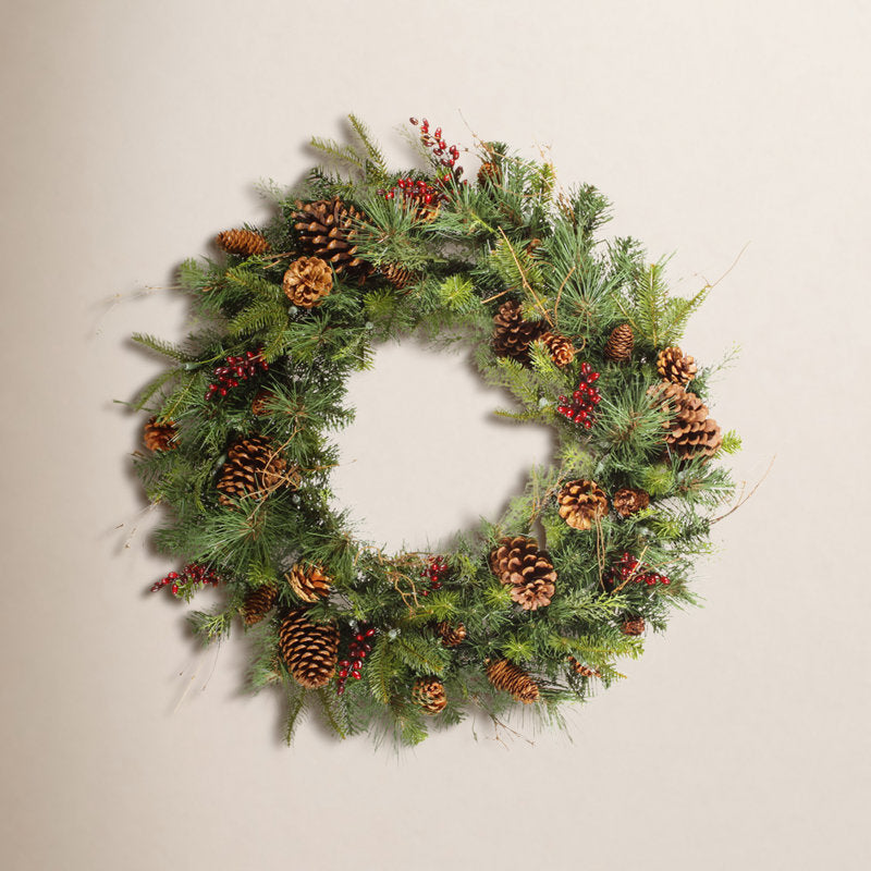 Artificial Berry Christmas Wreath hung on a wooden door