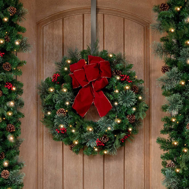 24" Pre-Lit Berry Christmas Wreath hanging on a front door