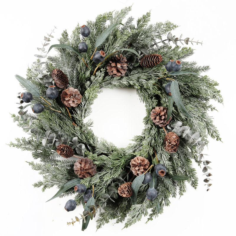 Eucalyptus Christmas Wreath hung on a wooden door