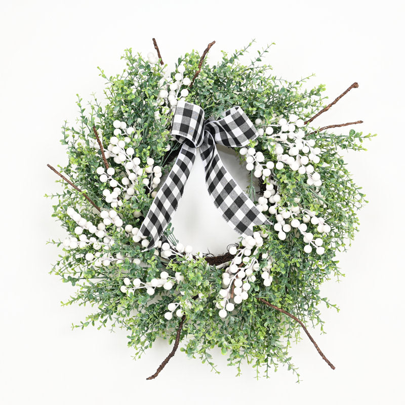 24" Pine Christmas Wreath hung on a wooden door