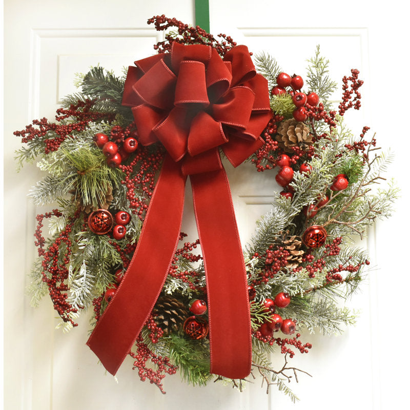 22" Artificial Christmas Wreath displayed on a front door