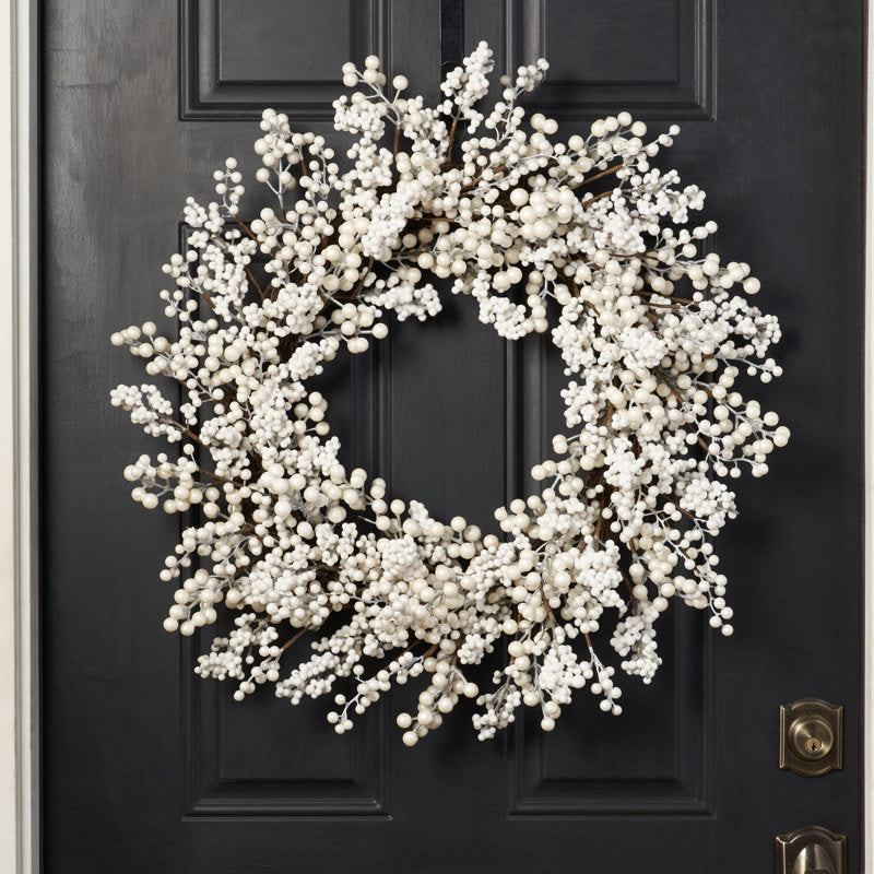 24" Pre-Lit Christmas Wreath hung on a wooden door