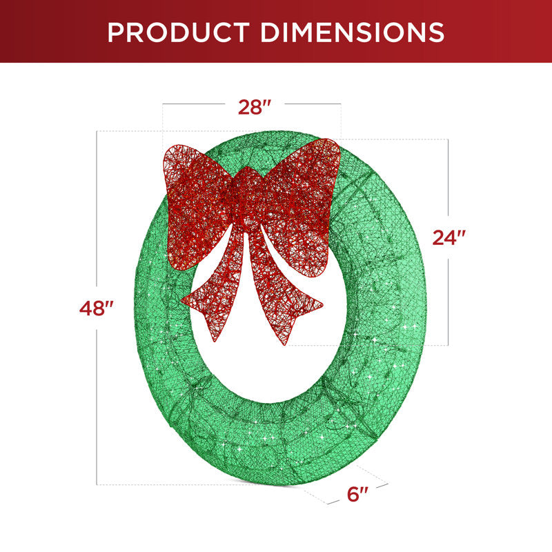 Artificial Pine Christmas Wreath hung on a wooden door