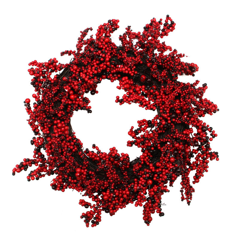 22" Artificial Berry Christmas Wreath hung on a wooden door