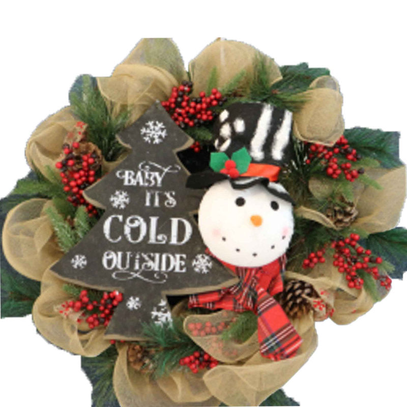 20" Artificial Christmas Wreath hung on a wooden door