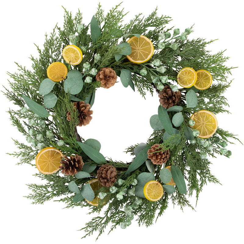 22" Artificial Eucalyptus Christmas Wreath hung on a wooden door