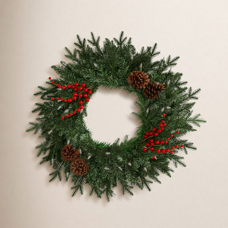 25" Artificial Christmas Wreath hung on a wooden door