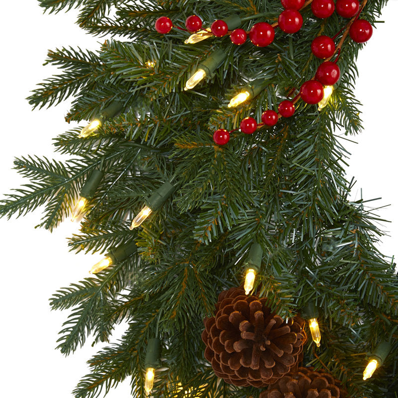 25" Artificial Christmas Wreath hung on a wooden door