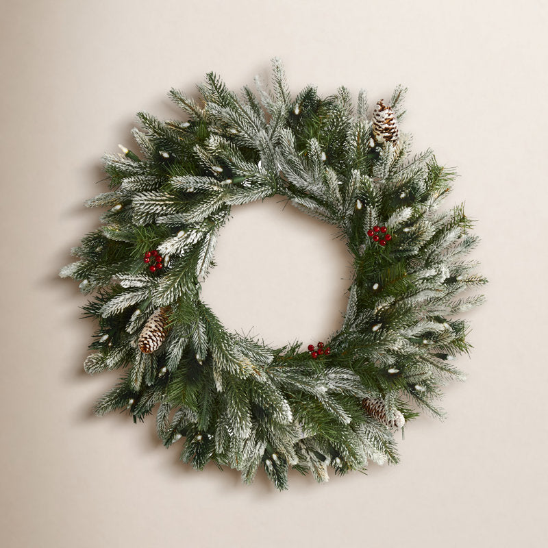 24" Farmhouse Artificial Cedar Christmas Wreath hung on a wooden door