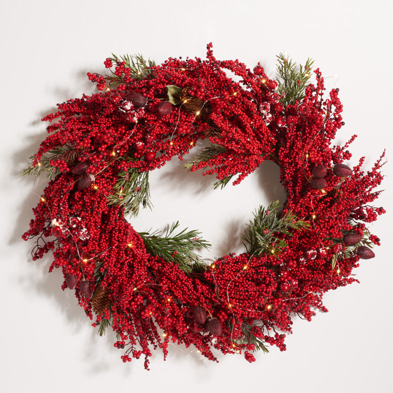16" Artificial Spruce Christmas Wreath hung on a wooden door