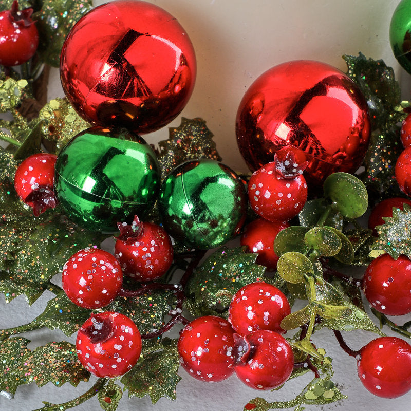 26" Artificial Berry Christmas Wreath hung on a wooden door