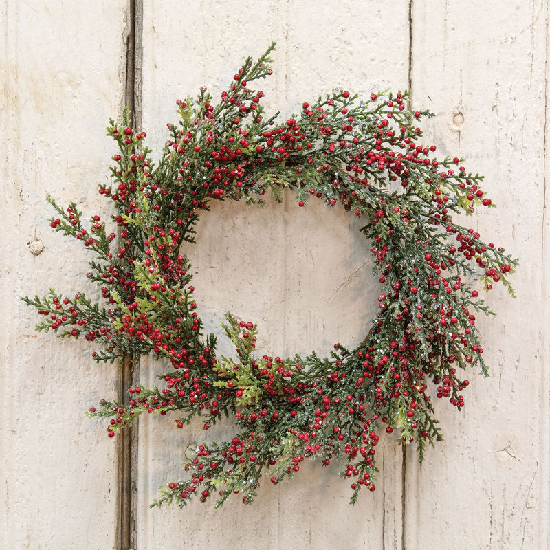 Pine Christmas Wreath hung on a wooden door