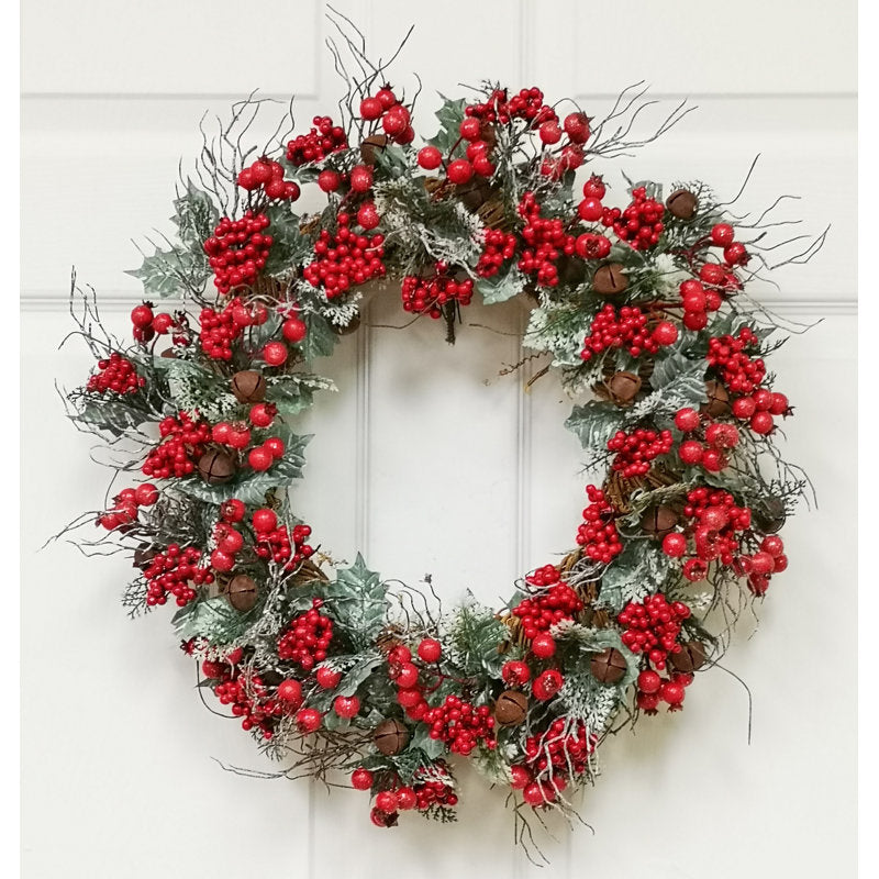 22" Artificial Pine Christmas Wreath displayed on a front door