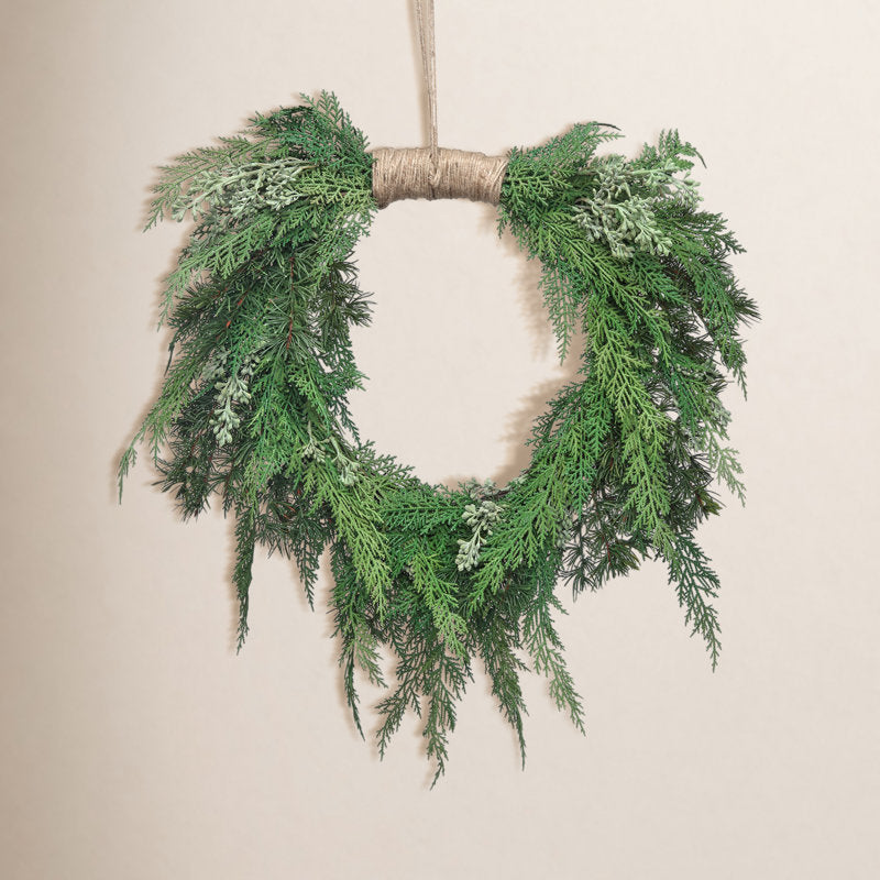 16" Artificial Poinsettia Christmas Wreath hung on a wooden door