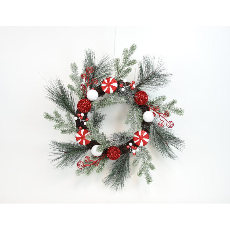 Pre-Lit Christmas Wreath displayed on a front door