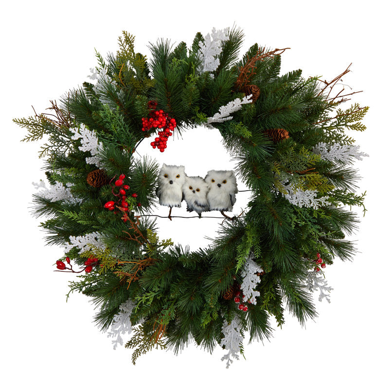 24" Artificial Pine Christmas Wreath hung on a wooden door