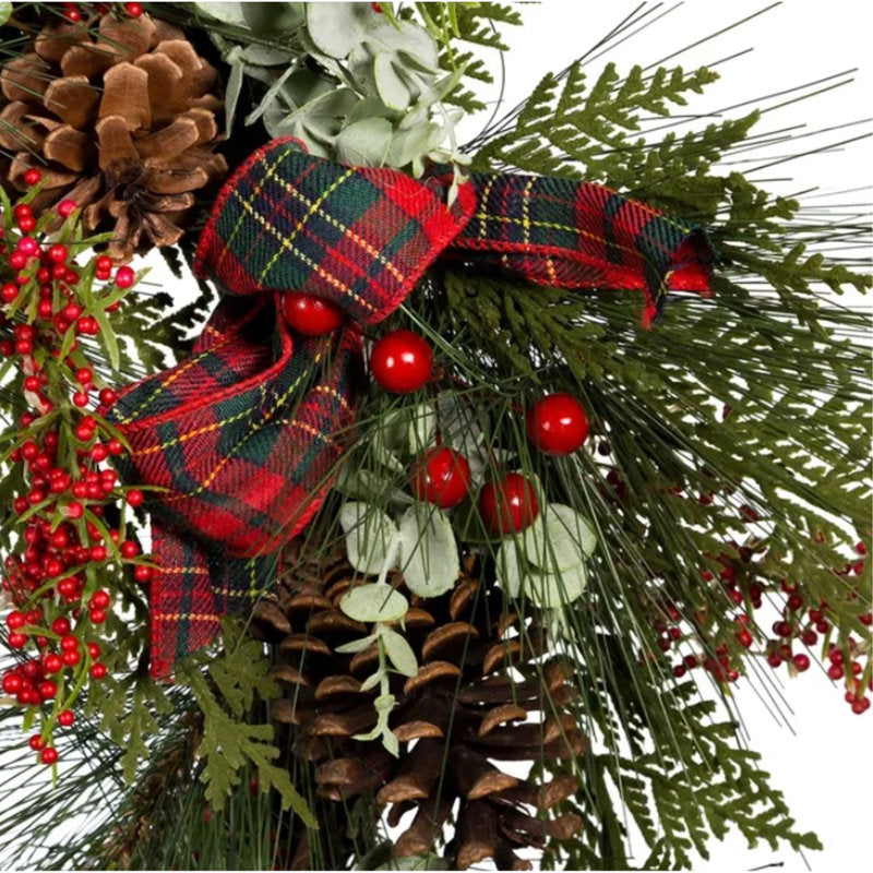 Pine Christmas Wreath displayed on a front door