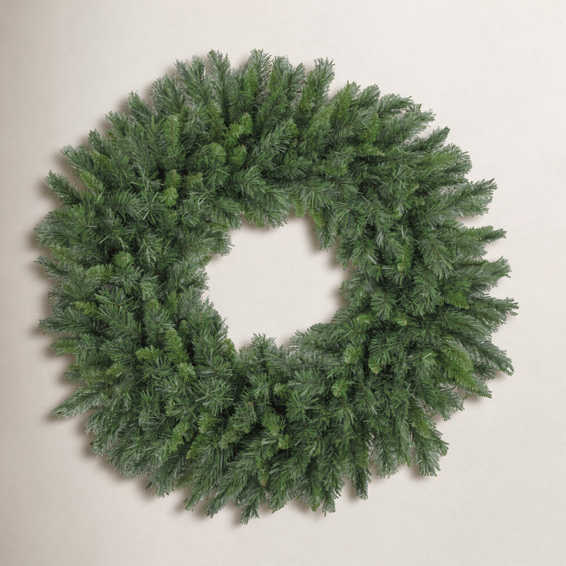 22" Artificial Christmas Wreath hung on a wooden door