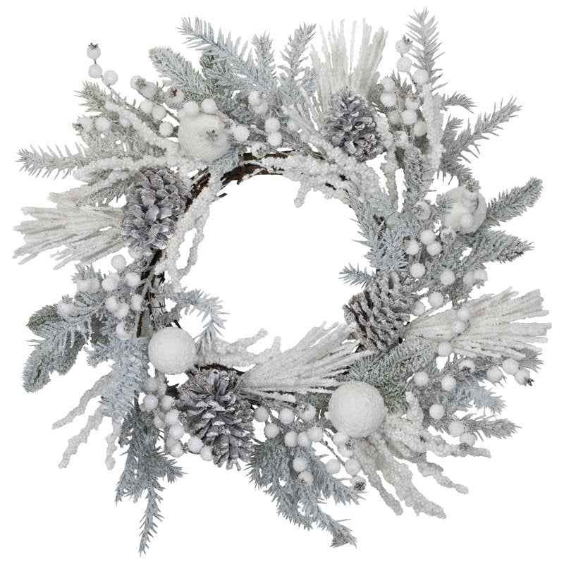 26" Flocked Artificial Pine Christmas Wreath hanging on a front door