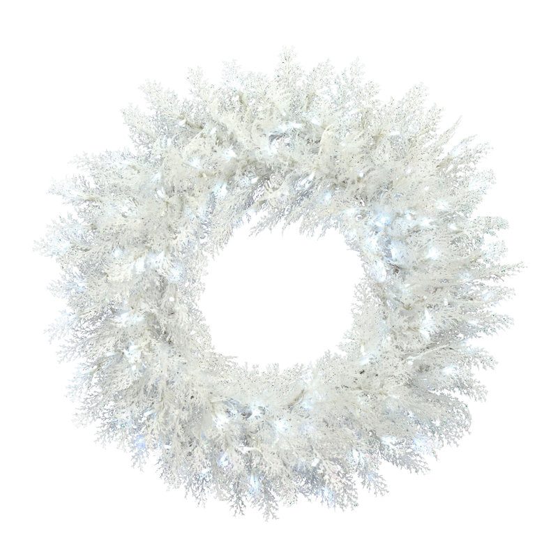 Flocked Artificial Cedar Christmas Wreath hanging on a front door