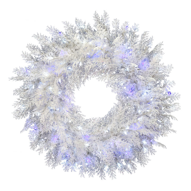 Flocked Artificial Cedar Christmas Wreath hanging on a front door