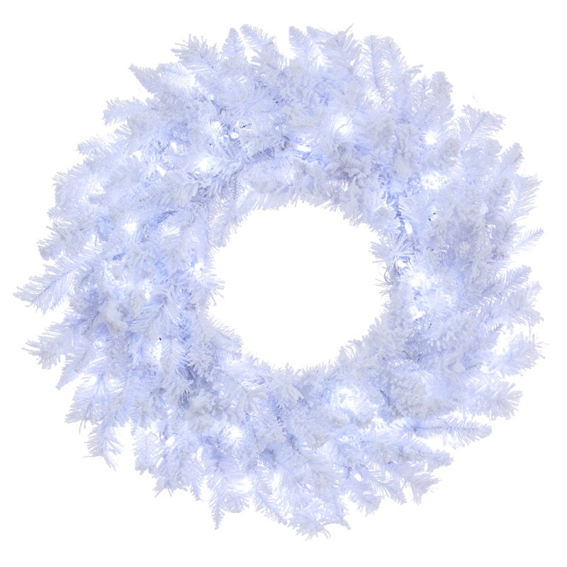 Flocked Christmas Wreath hung on a wooden door