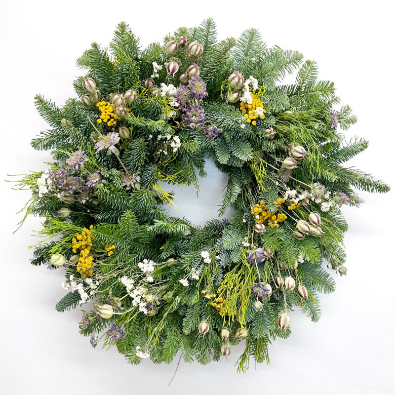 Christmas Wreath hung on a wooden door
